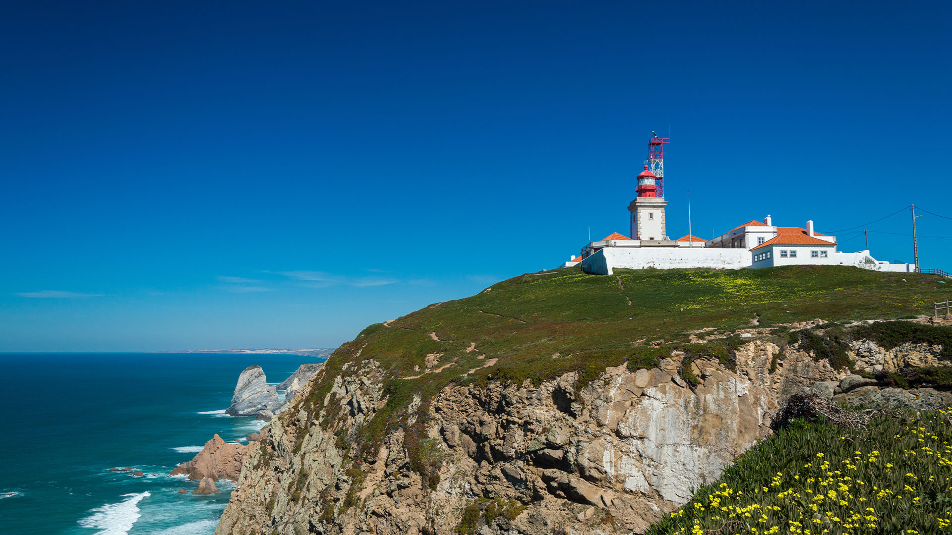 Clifftop lighthouse overlooking the Atlantic Ocean