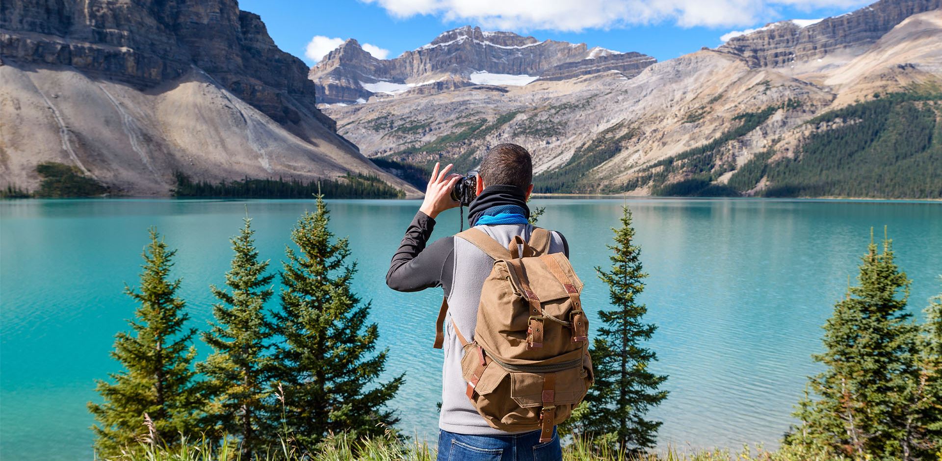 Tourist taking pictures of the mountains in Canada, Jasper and Banff National Park.