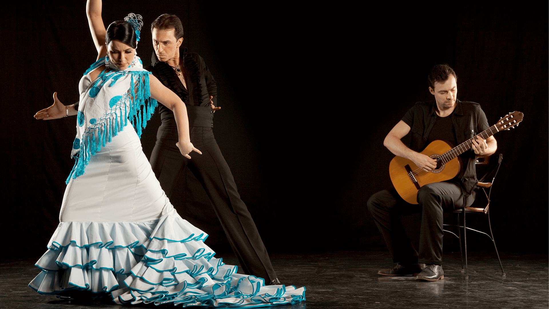 Two Flamenco dancers, a man and a woman, dancing 