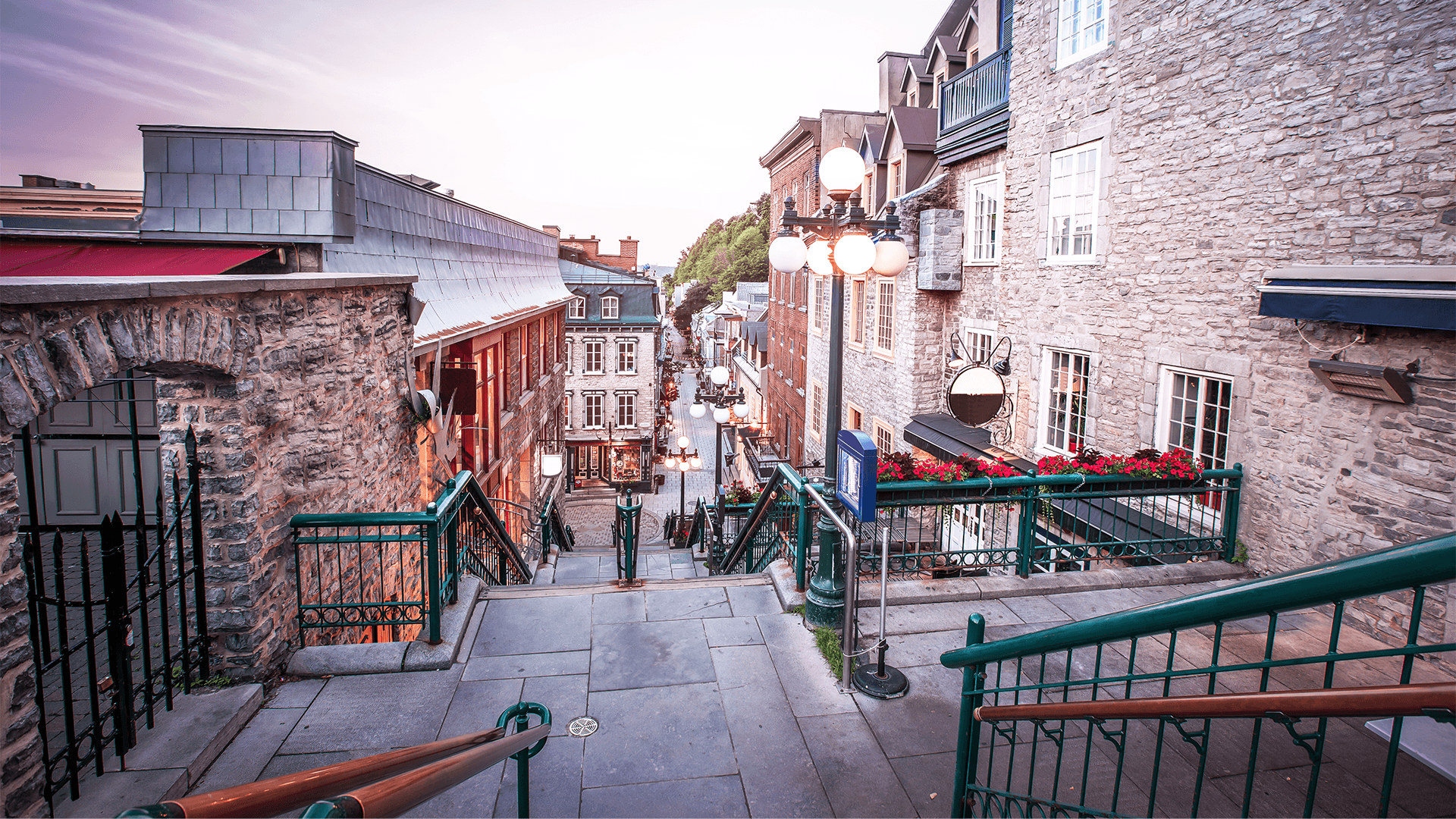 A hilly street in Quebec City’s historic district at dusk