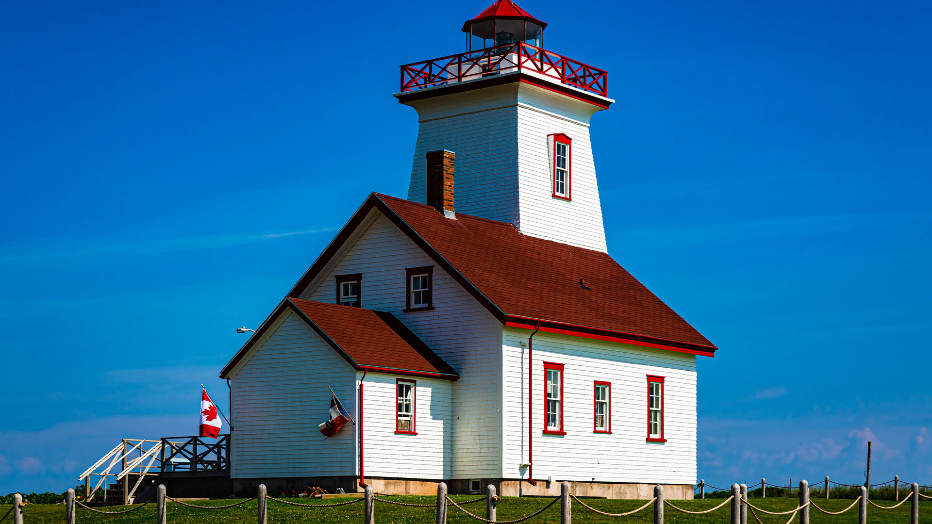 Red and white lighthouse on a sunny day