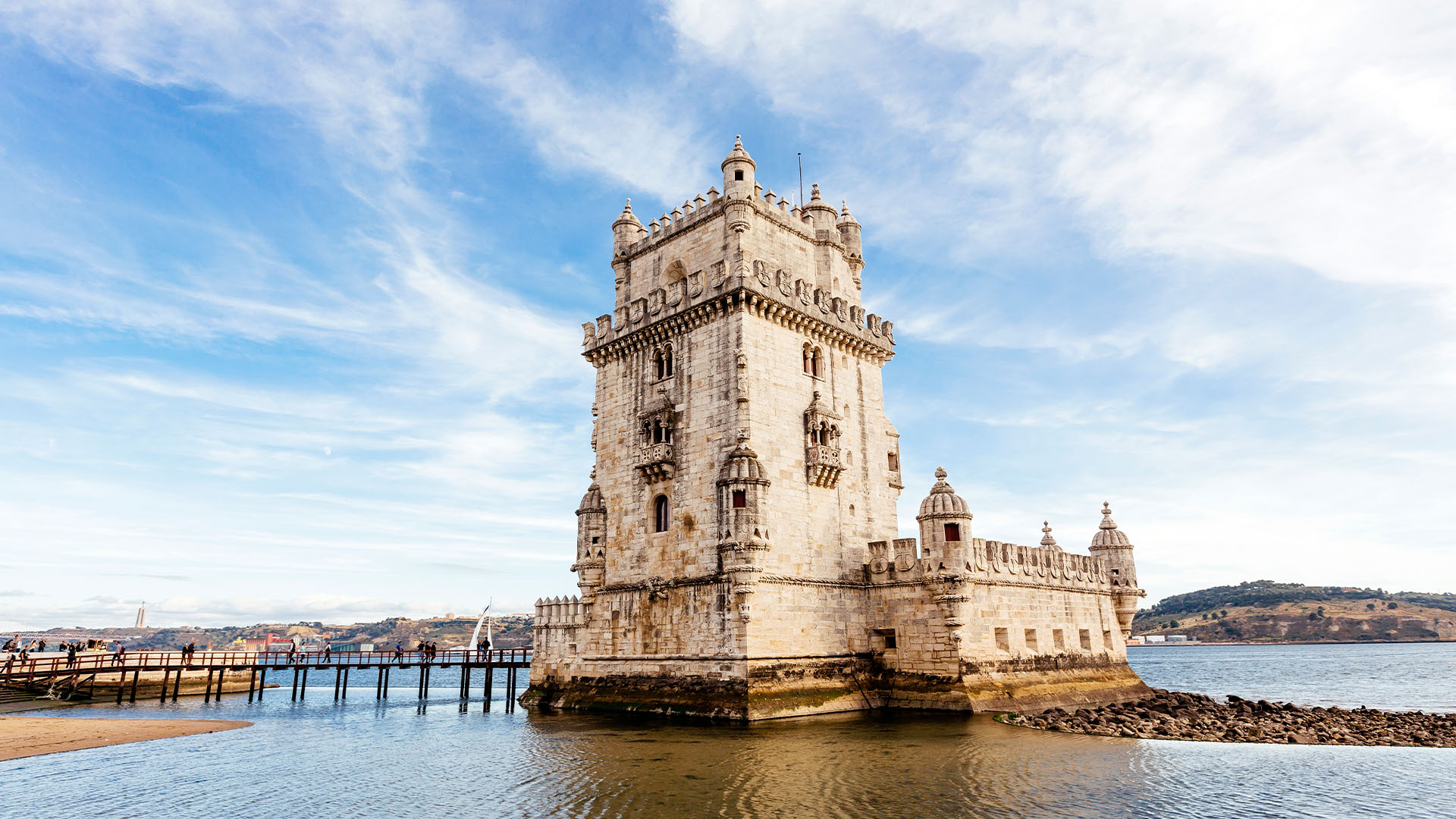 Belem Tower rising from the sea near the shore