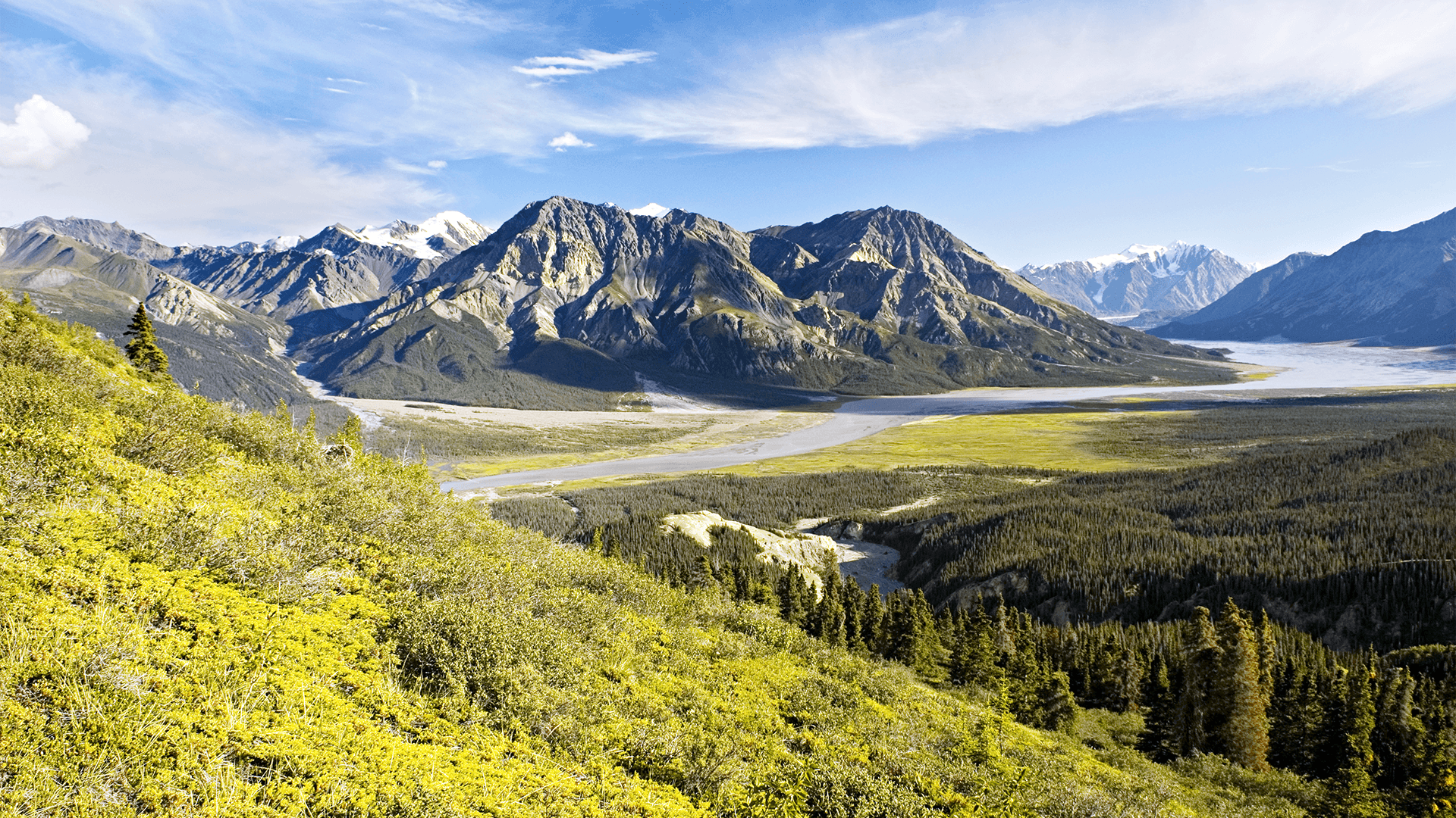 Kluane National Park river valley under a blue sky