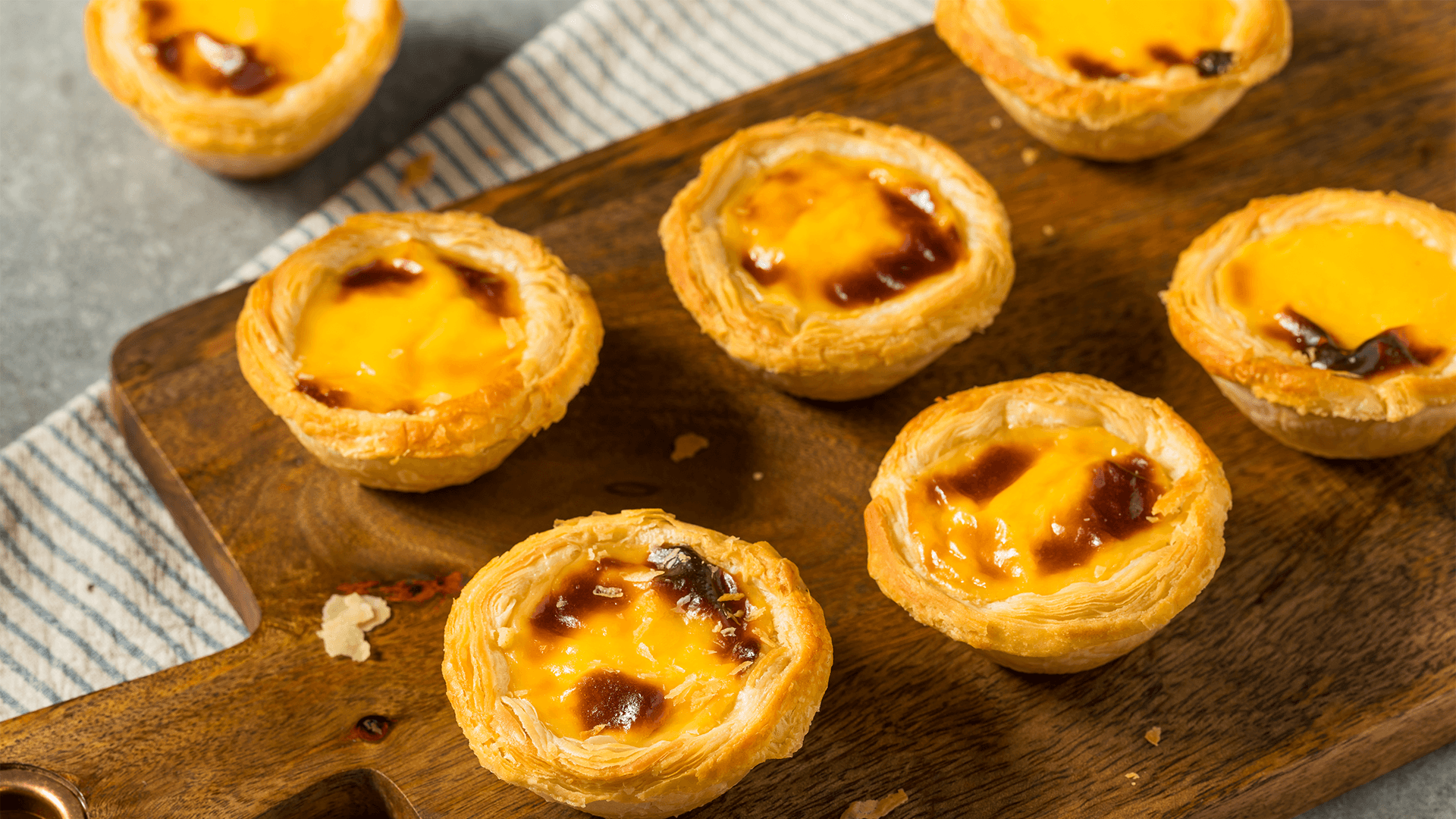 Close-up of Pastel de Nata on cutting board