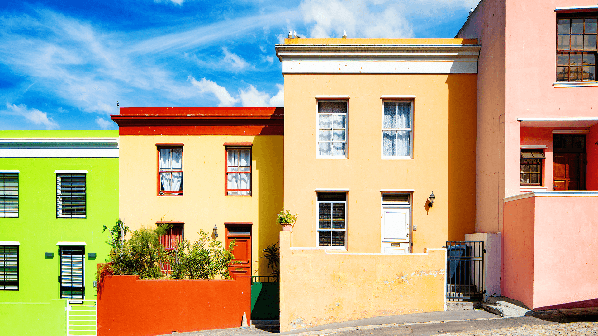 Row of colourful houses built on a hillside
