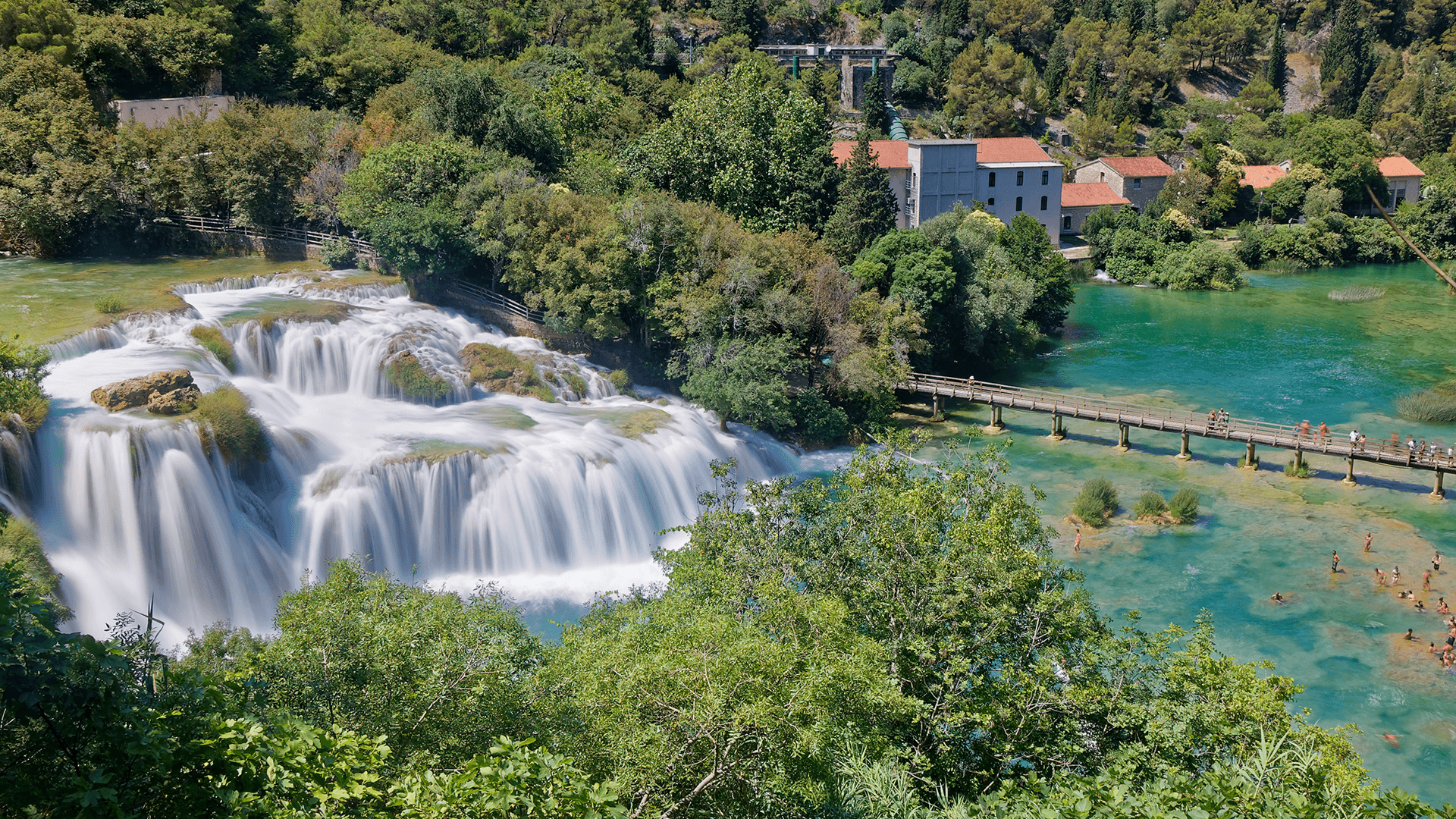 Krka waterfalls with wooden path and turquoise pools
