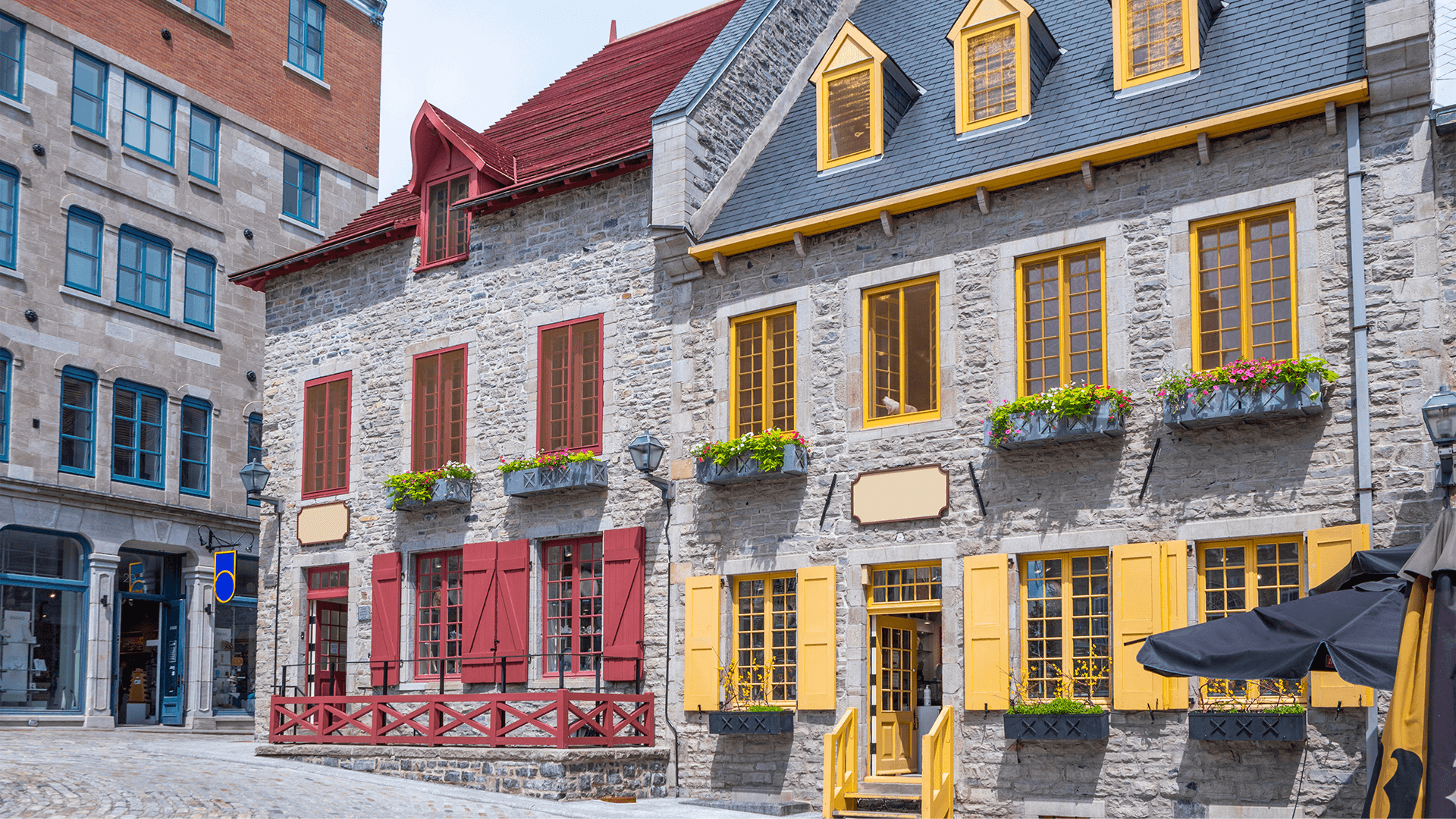 Old stone buildings with brightly painted trim
