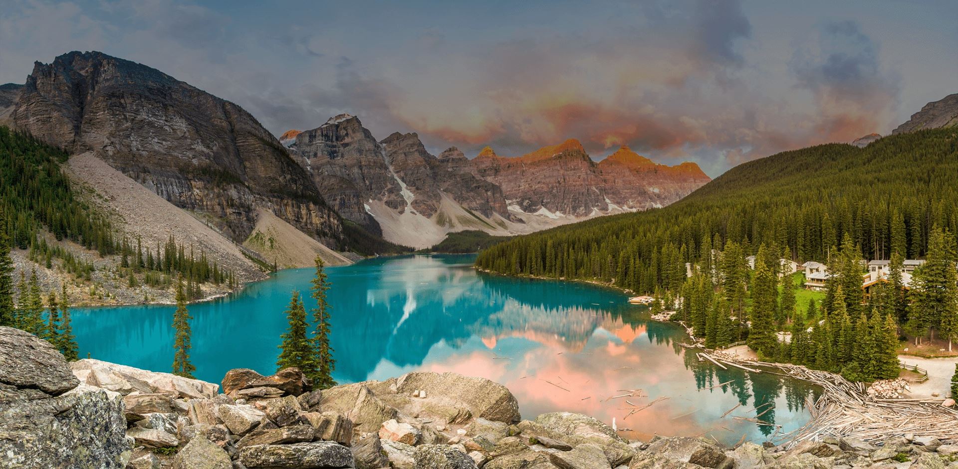 Colouful view of Moraine Lake, forest and mountains reflected in the lake in Banff National Park, Alberta, Canada.