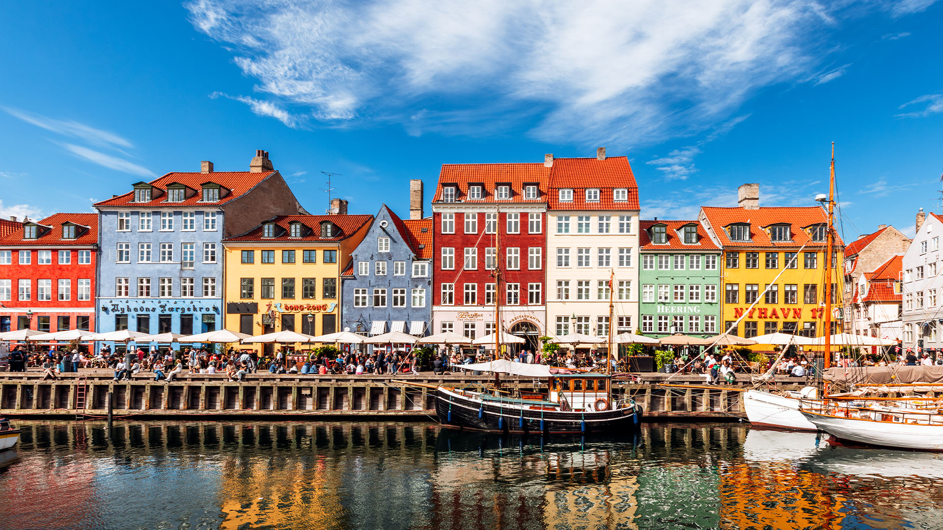 Colourful vibrant houses along a canal on a sunny day