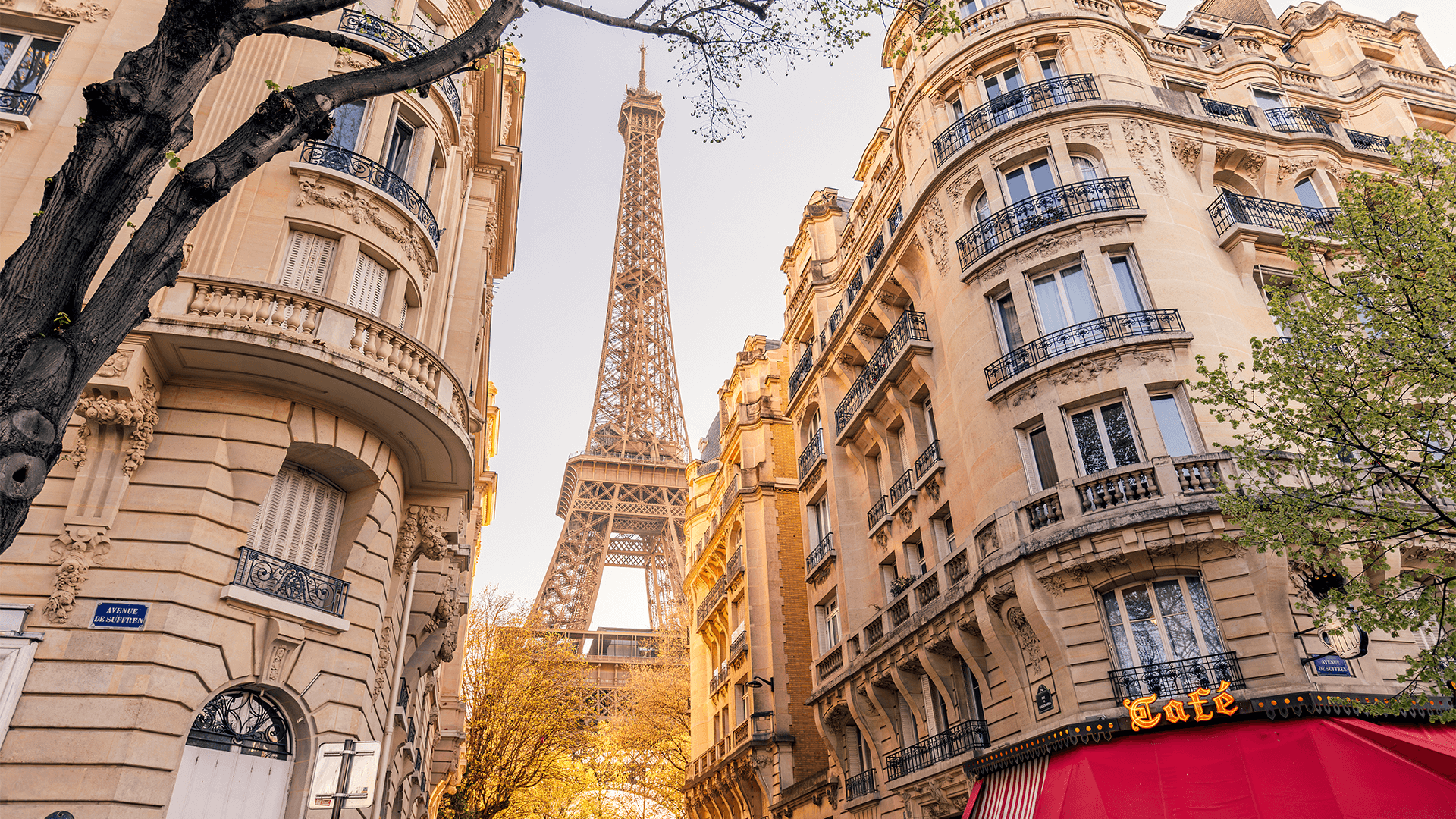 Eiffel Tower view from a Paris street on a sunny day