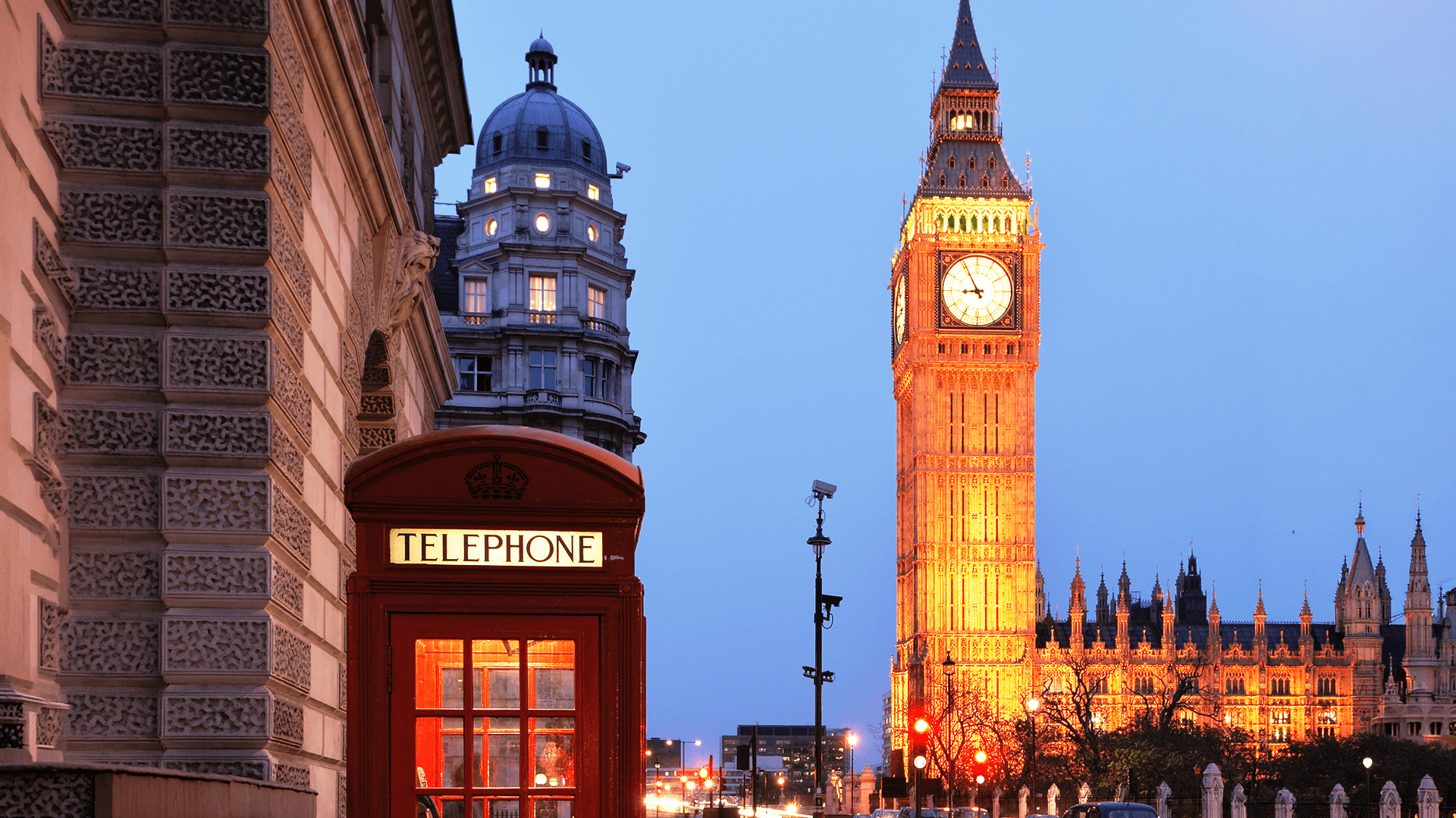 Red phone booth with Big Ben in the background