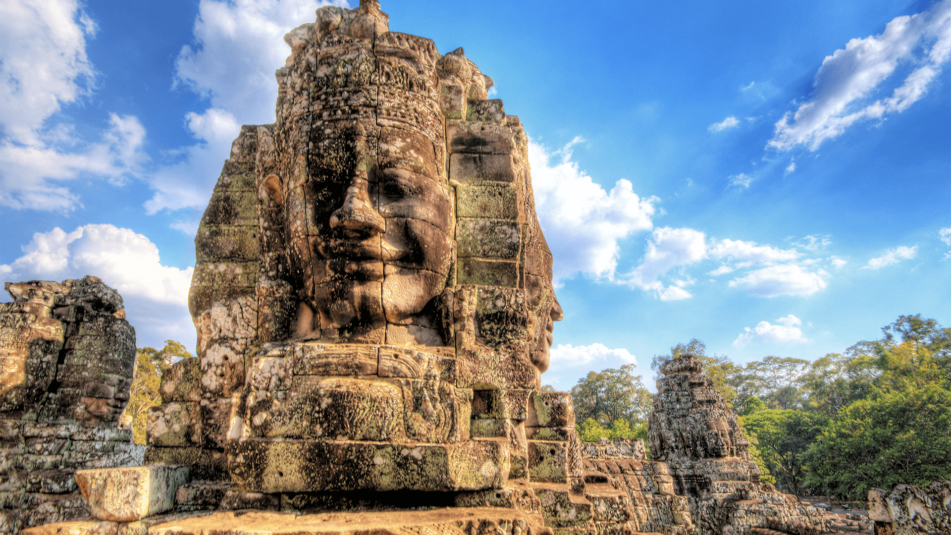 Ancient stone face tower beneath the blue sky 